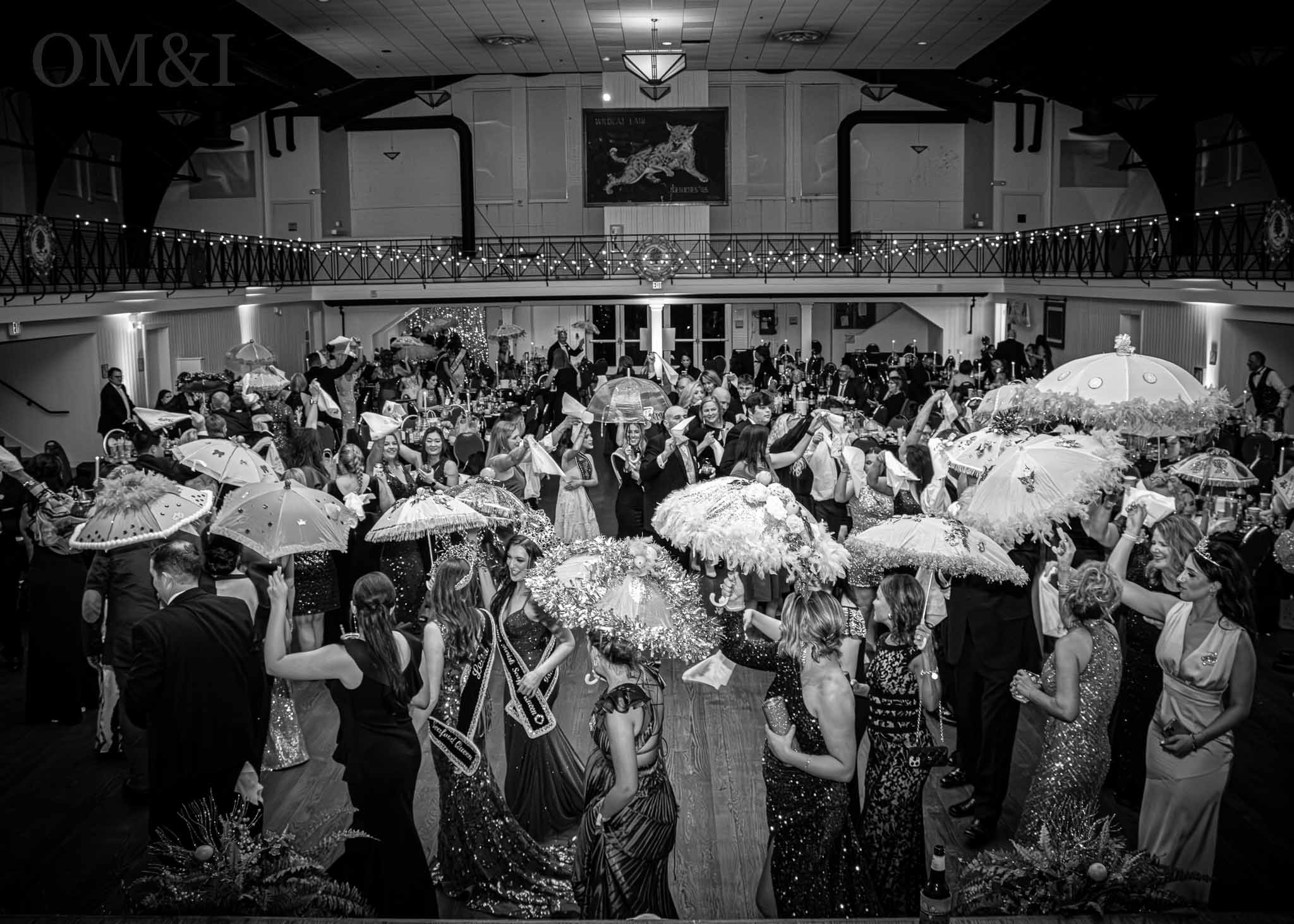 Black-and-white overhead view of a crowded formal community celebration