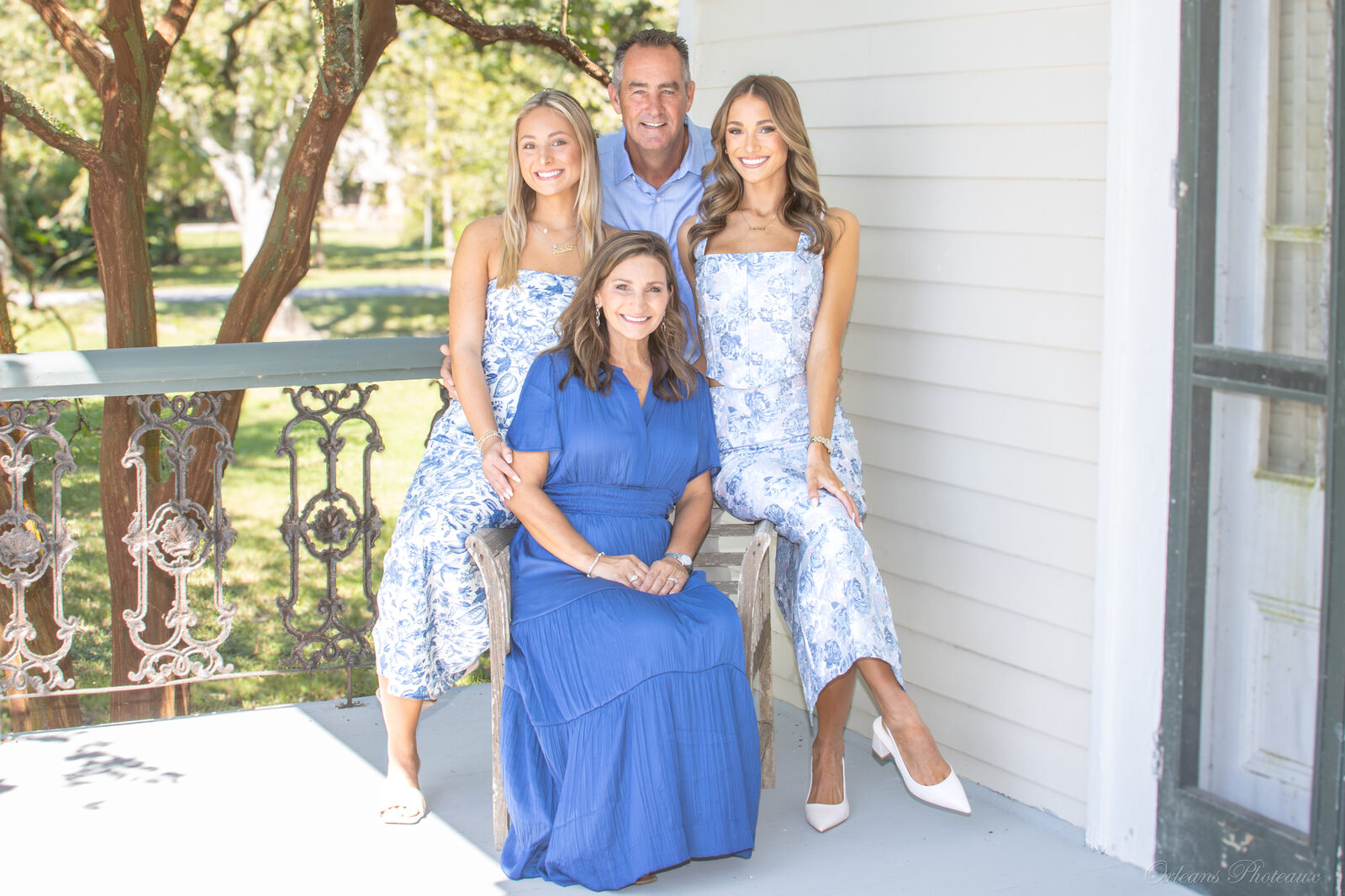 A multigenerational family portrait on a Louisiana porch