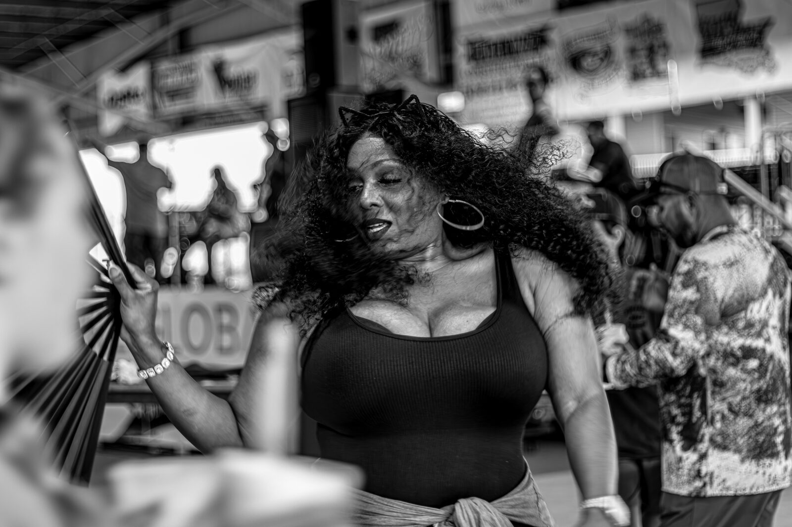 Black-and-white candid portrait during a Louisiana festival